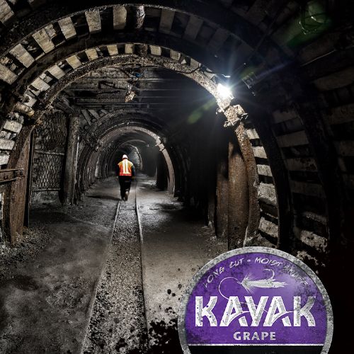 Kayak Grape - Miner walking through a mine tunnel